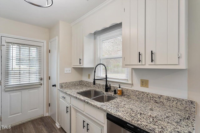 kitchen featuring white cabinetry, a wealth of natural light, and a sink