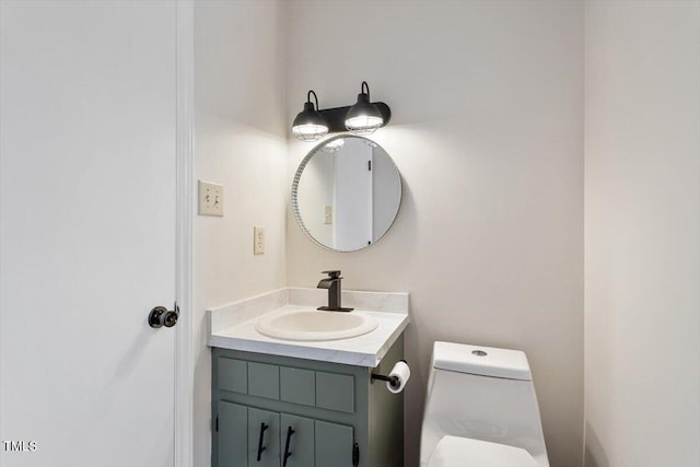 bathroom featuring toilet and vanity