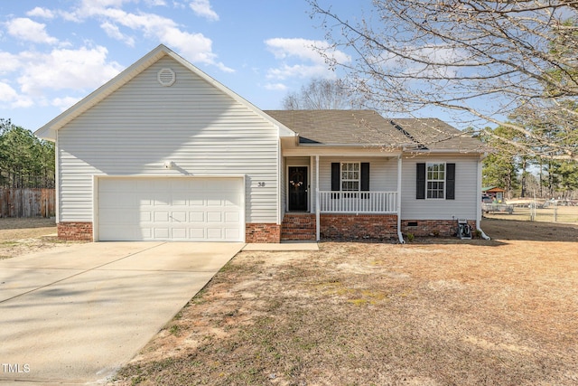 ranch-style house featuring roof with shingles, a porch, concrete driveway, an attached garage, and crawl space