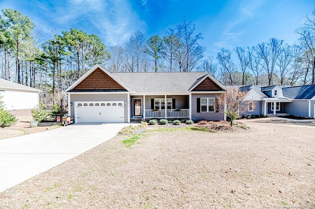 ranch-style home featuring covered porch, driveway, roof with shingles, and a garage