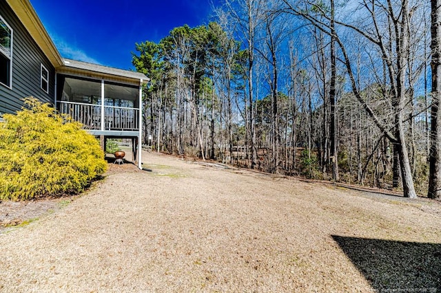 view of yard featuring a sunroom