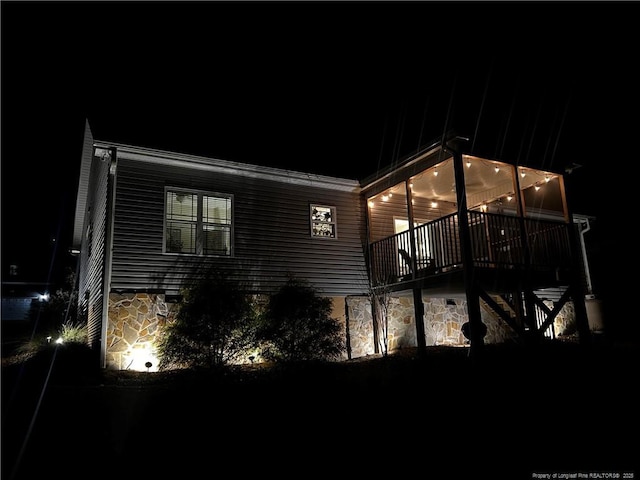 view of property exterior at night