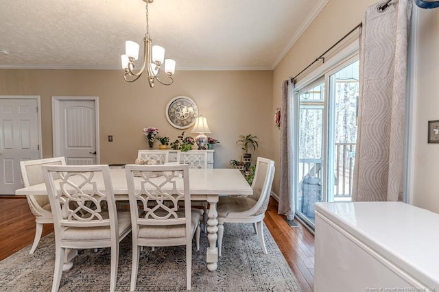 dining area with light wood-style floors, a chandelier, and crown molding