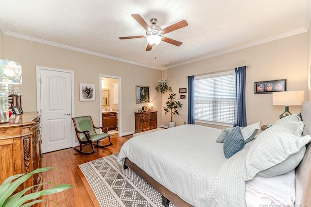 bedroom with ensuite bath, light wood-style flooring, ceiling fan, and crown molding