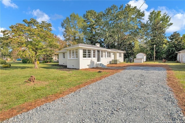 view of front of home with a chimney, entry steps, crawl space, cooling unit, and a front lawn