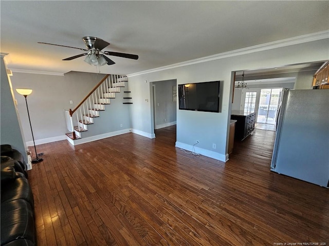 unfurnished living room featuring baseboards, stairway, dark wood finished floors, and crown molding