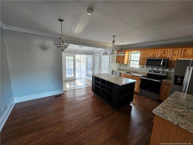 kitchen featuring dark wood finished floors, open shelves, stainless steel appliances, ornamental molding, and a sink