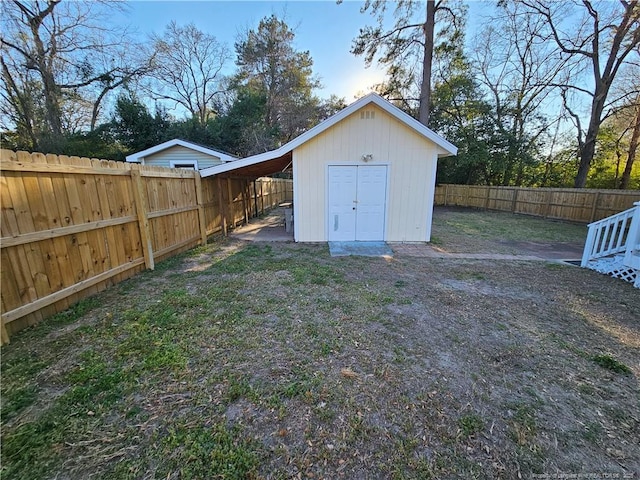 view of shed featuring a fenced backyard