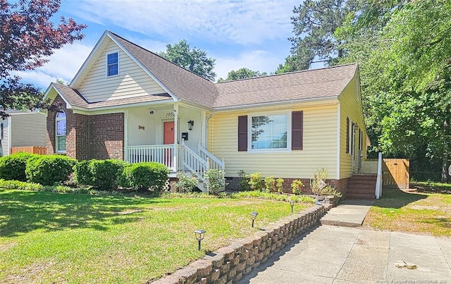 1003 Anarine Rd, Fayetteville, NC 28303 - view of front of property featuring a front lawn and a shingled roof
