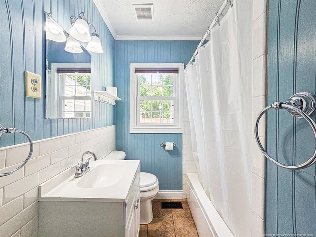 1003 Anarine Rd, Fayetteville, NC 28303 - bathroom featuring plenty of natural light, crown molding, toilet, vanity, and tile patterned floors