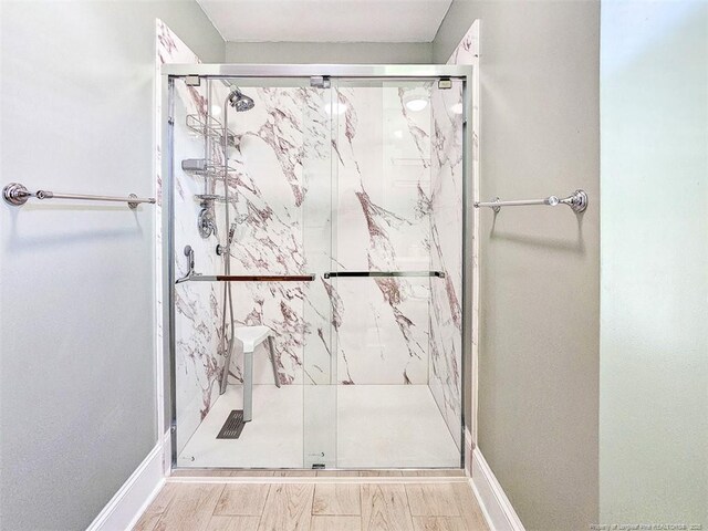 1003 Anarine Rd, Fayetteville, NC 28303 - full bathroom with a stall shower and baseboards