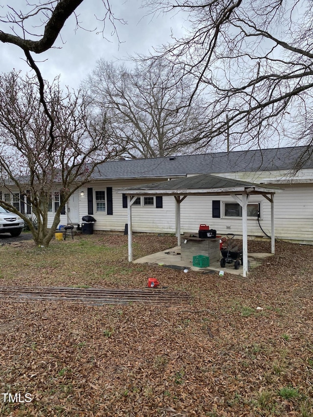 back of property with a patio area