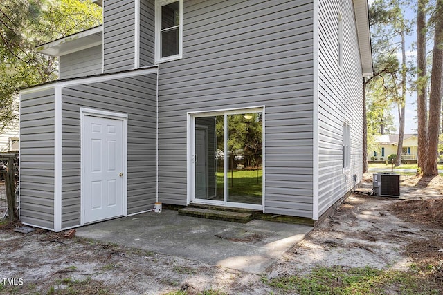 exterior space with a patio area and central AC unit