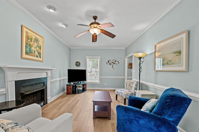 6509 Virgilia Ct, Raleigh, NC 27616 - living area featuring ceiling fan, a fireplace, wood finished floors, baseboards, and ornamental molding