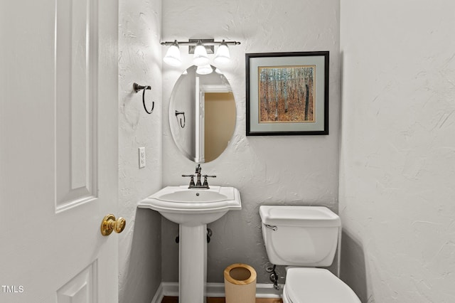 6509 Virgilia Ct, Raleigh, NC 27616 - half bath with a textured wall and toilet