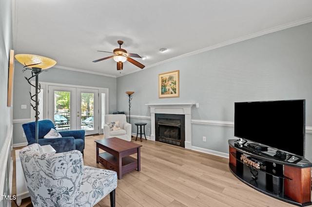 6509 Virgilia Ct, Raleigh, NC 27616 - living room with a ceiling fan, french doors, crown molding, a fireplace, and light wood-style floors