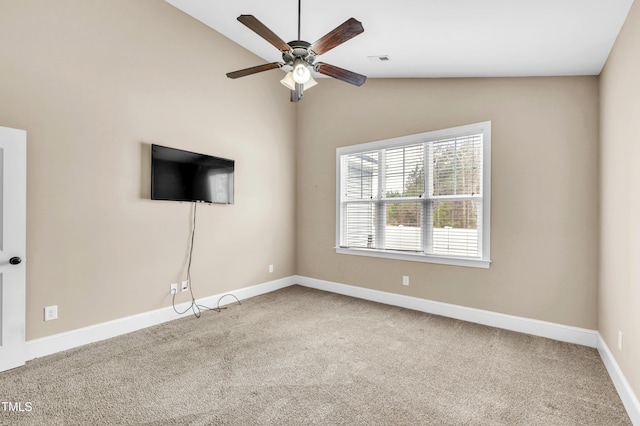 unfurnished living room featuring visible vents, a ceiling fan, baseboards, carpet, and lofted ceiling