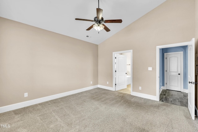 unfurnished bedroom featuring visible vents, high vaulted ceiling, ensuite bathroom, carpet floors, and baseboards