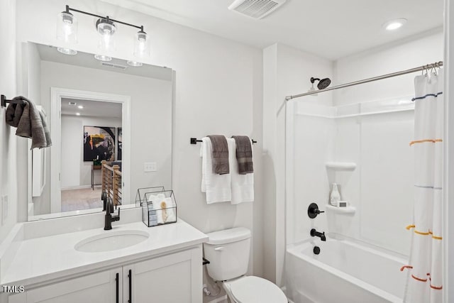 bathroom featuring shower / bath combo, visible vents, vanity, and toilet