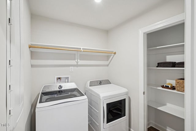 clothes washing area with laundry area and separate washer and dryer