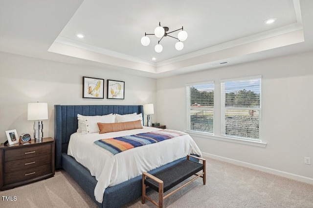 bedroom with baseboards, visible vents, light colored carpet, a tray ceiling, and recessed lighting