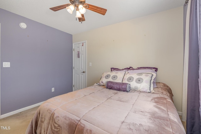 bedroom featuring carpet floors, a ceiling fan, and baseboards