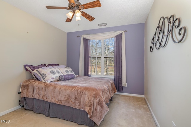 carpeted bedroom with visible vents, baseboards, ceiling fan, vaulted ceiling, and a textured ceiling