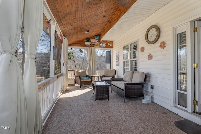 sunroom featuring lofted ceiling, wood ceiling, and a ceiling fan