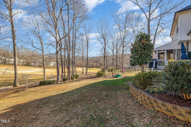 view of yard with a sunroom