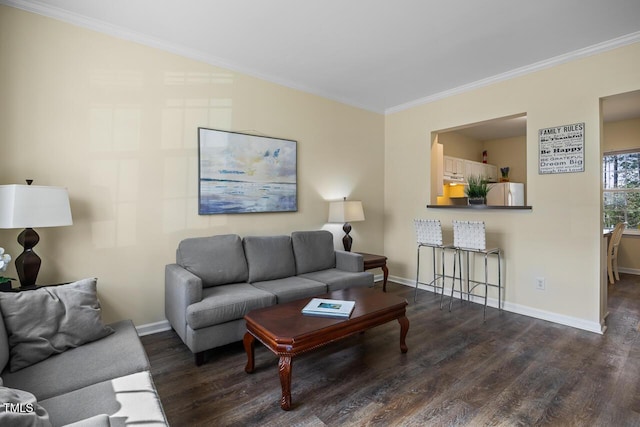 living area with dark wood-style flooring, crown molding, and baseboards