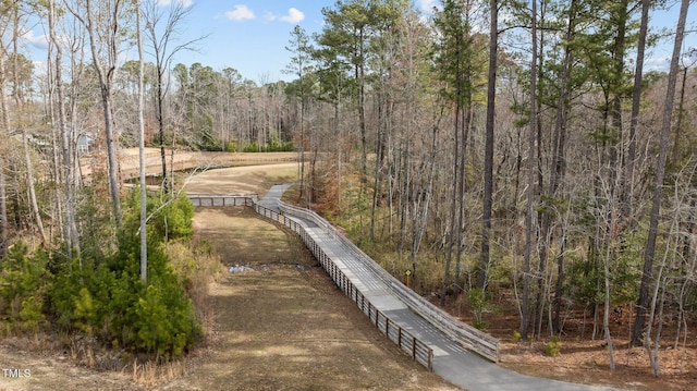 view of street featuring a forest view