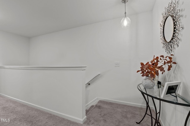 stairway with carpet floors and baseboards