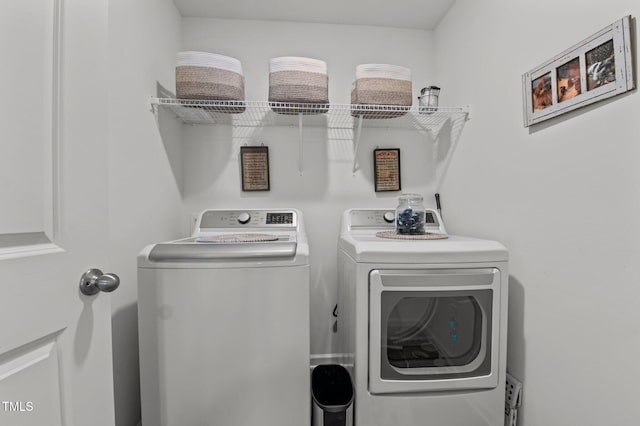 laundry area with laundry area and washing machine and dryer