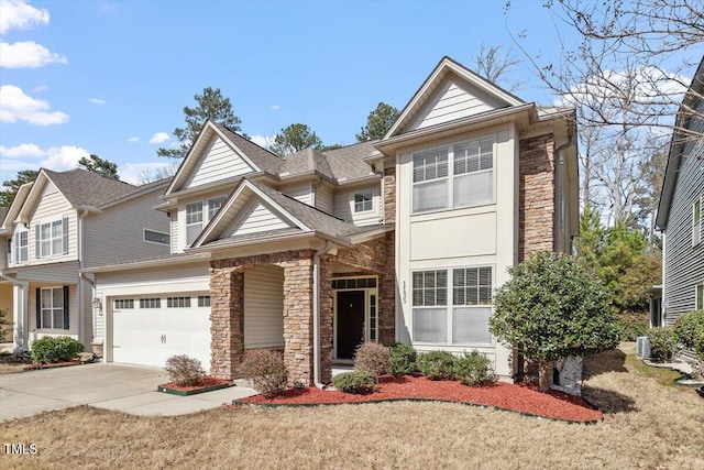 view of front of home with a shingled roof, stone siding, driveway, and an attached garage