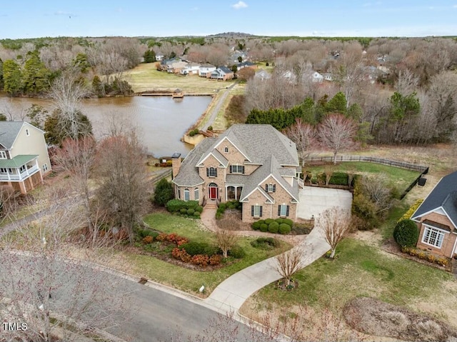 birds eye view of property with a water view