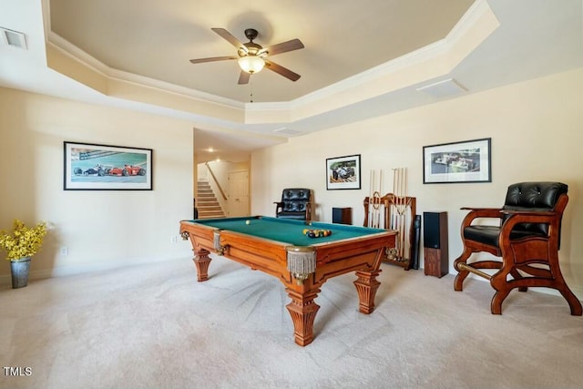 rec room featuring a tray ceiling, visible vents, and crown molding