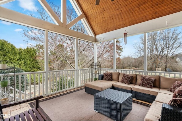 sunroom / solarium featuring lofted ceiling