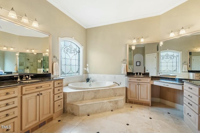 full bathroom with crown molding, two vanities, a stall shower, a sink, and a bath