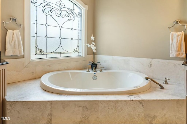 bathroom with a garden tub