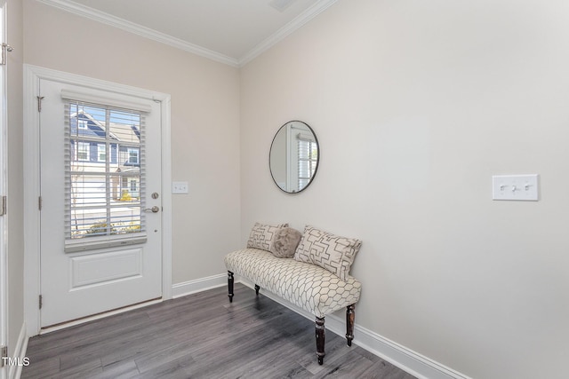 foyer entrance with baseboards, wood finished floors, and crown molding