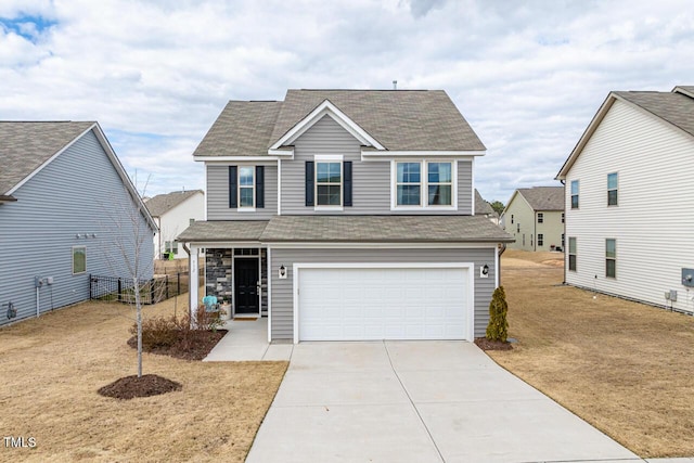 traditional-style home with driveway, a shingled roof, a garage, and fence