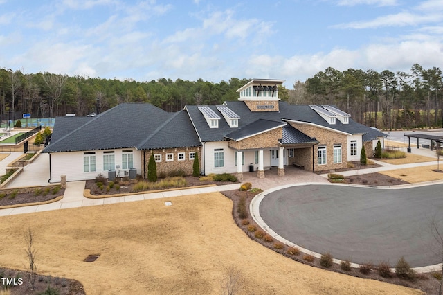 view of building exterior with dirt driveway