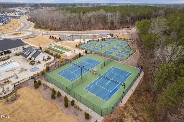 birds eye view of property with a view of trees