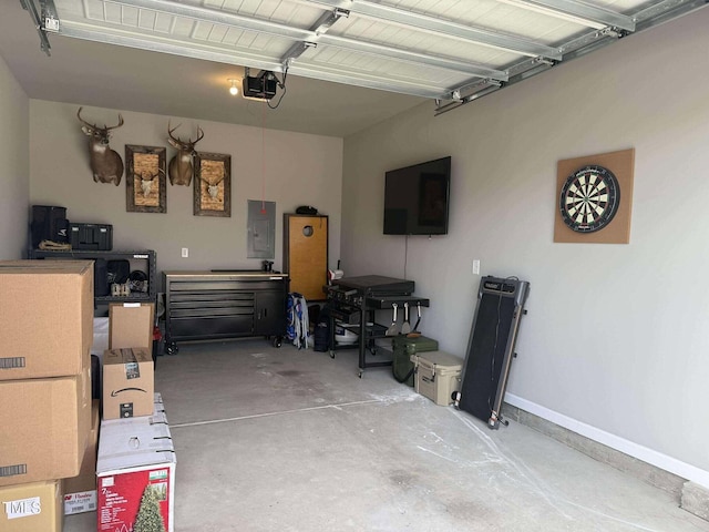 garage with electric panel and baseboards