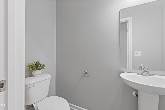 bathroom with a sink and toilet