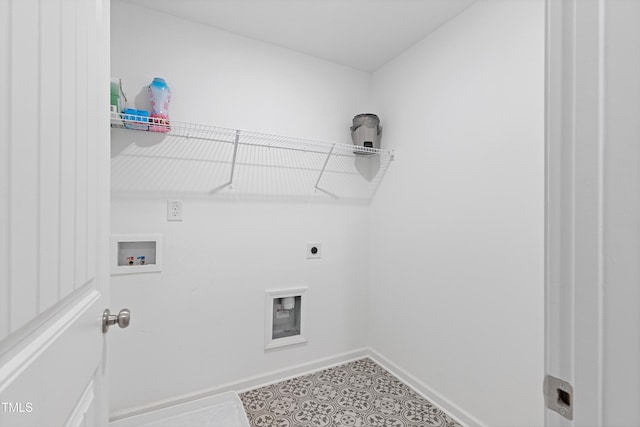 laundry area with laundry area, baseboards, tile patterned floors, hookup for a washing machine, and electric dryer hookup