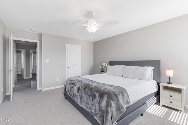 carpeted bedroom featuring a ceiling fan and baseboards