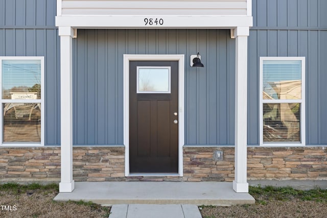 view of exterior entry with stone siding