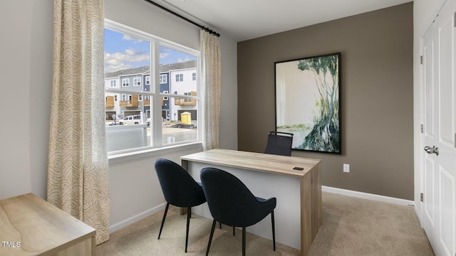 home office featuring carpet flooring and baseboards