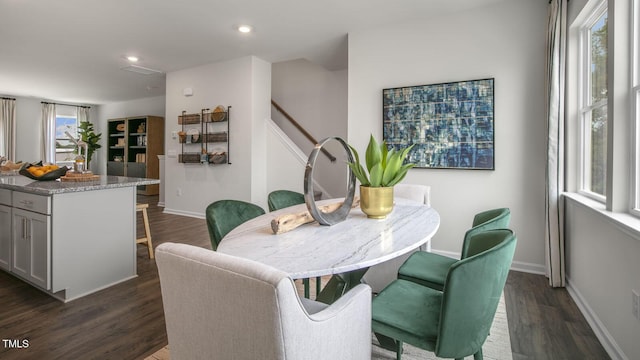 dining area featuring stairway, baseboards, dark wood-style flooring, and recessed lighting